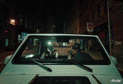 a police officer sitting in the driver's seat of a car