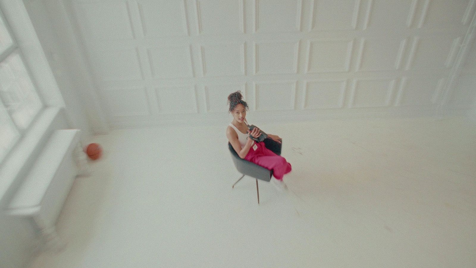 a woman sitting on a chair in a room