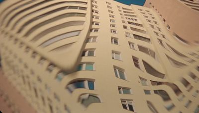 a very tall building with many windows and balconies