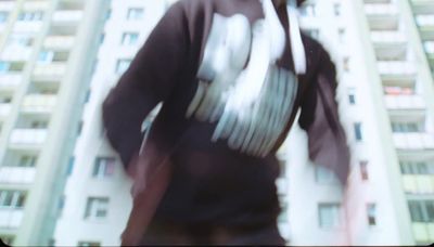 a blurry photo of a man in a hoodie