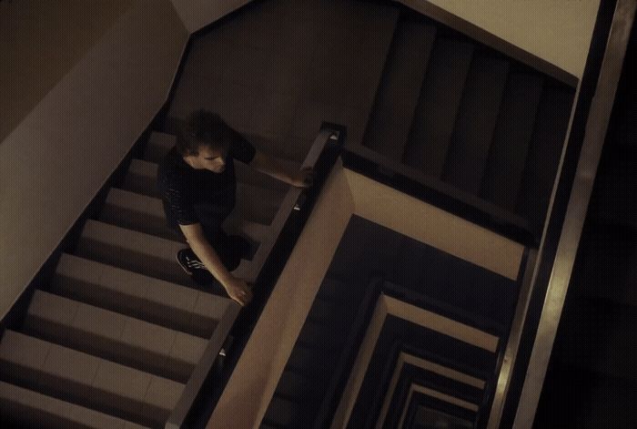 a woman walking down a flight of stairs