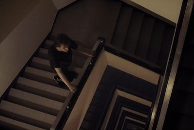 a woman walking down a flight of stairs