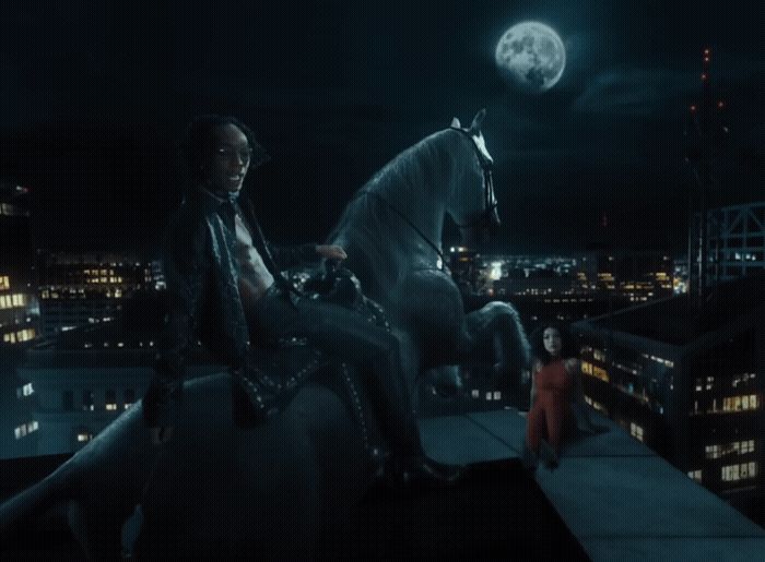 a woman sitting on top of a horse next to a man