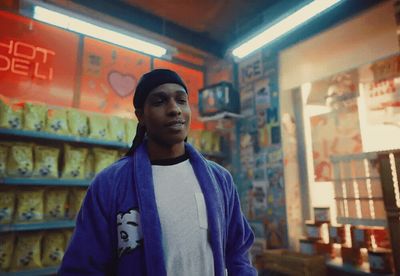 a man standing in front of a store