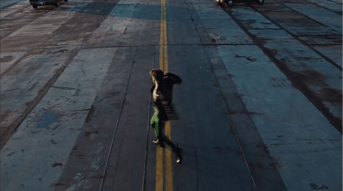 a person riding a skateboard on a runway