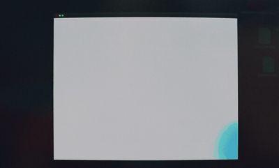 a white screen with a blue circle on it