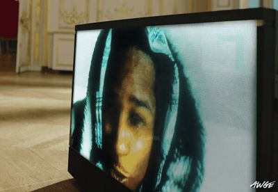 a television screen with a picture of a woman's face on it