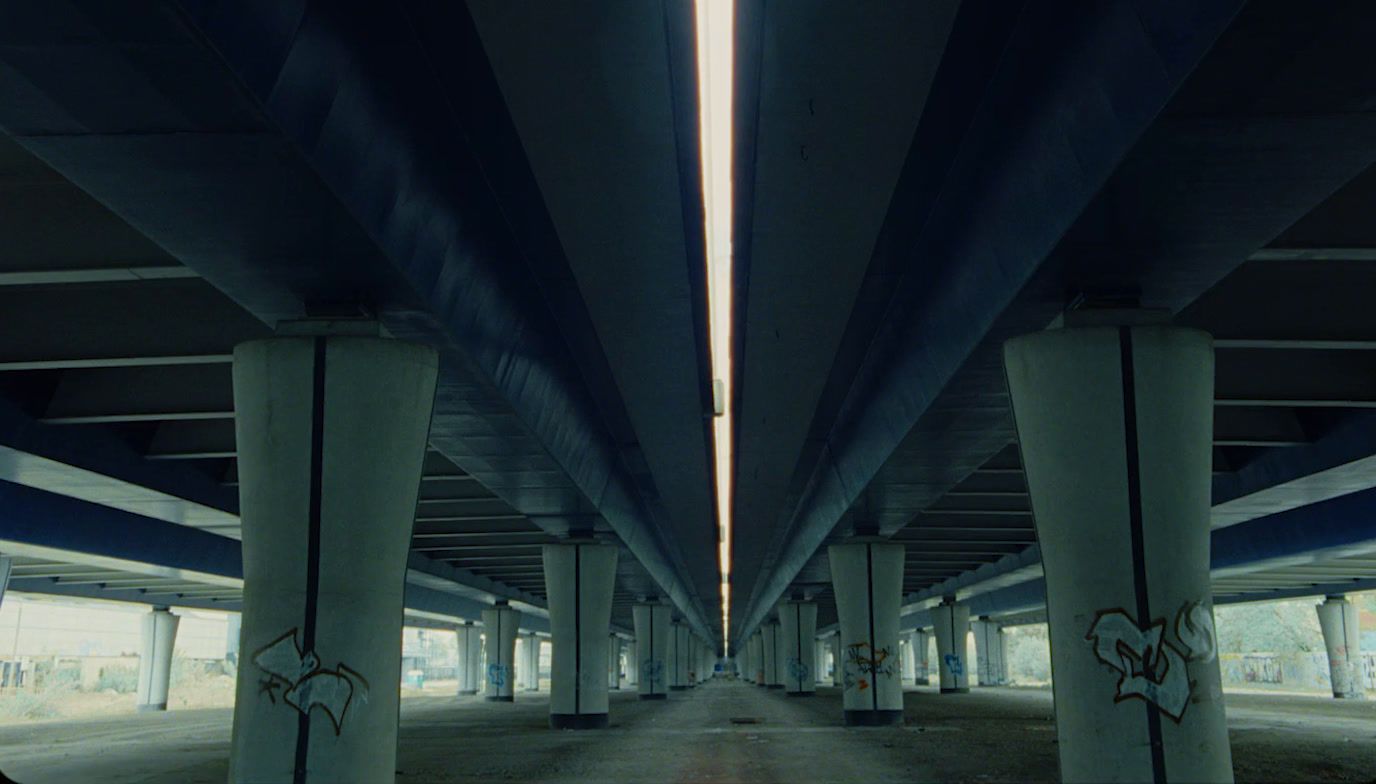 an empty parking garage with graffiti on it