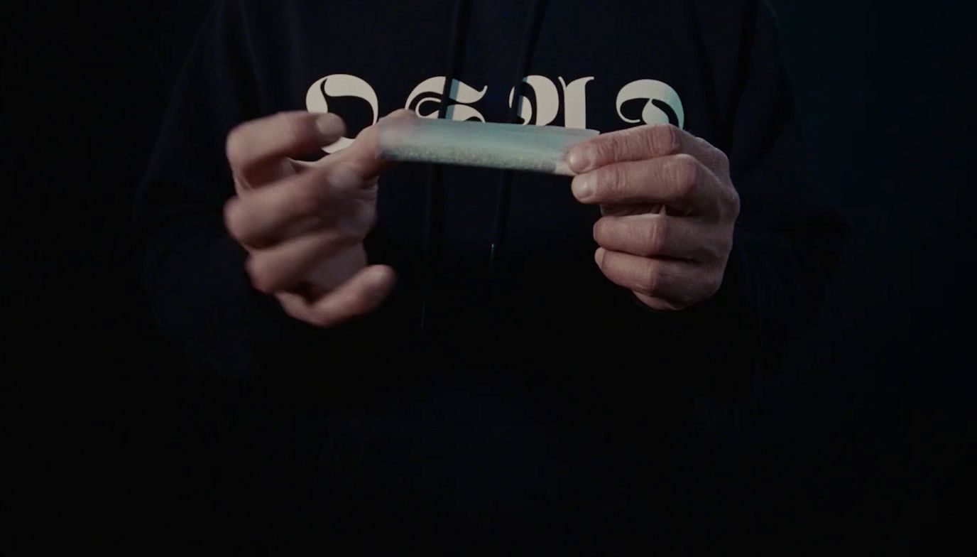 a person holding a piece of paper in their hands