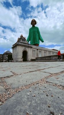 a woman standing in front of a building