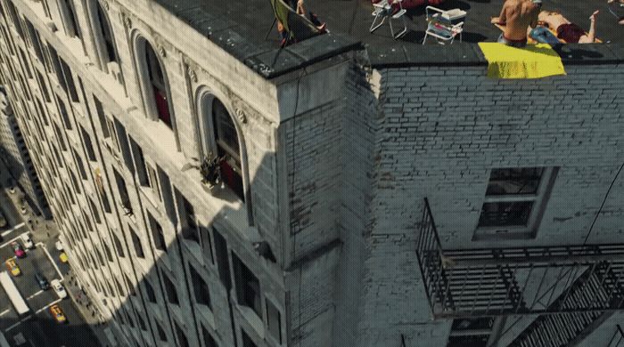 a group of people standing on top of a tall building