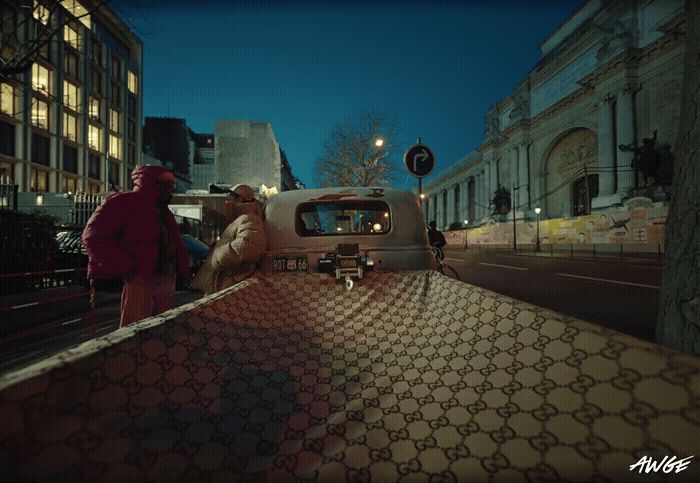 a man standing next to a truck on a city street