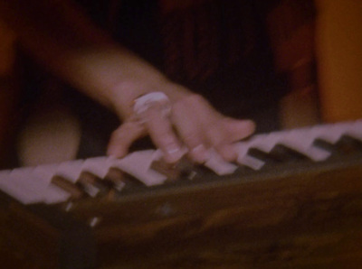 a close up of a person playing a keyboard