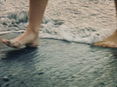 a close up of a person's feet in the water