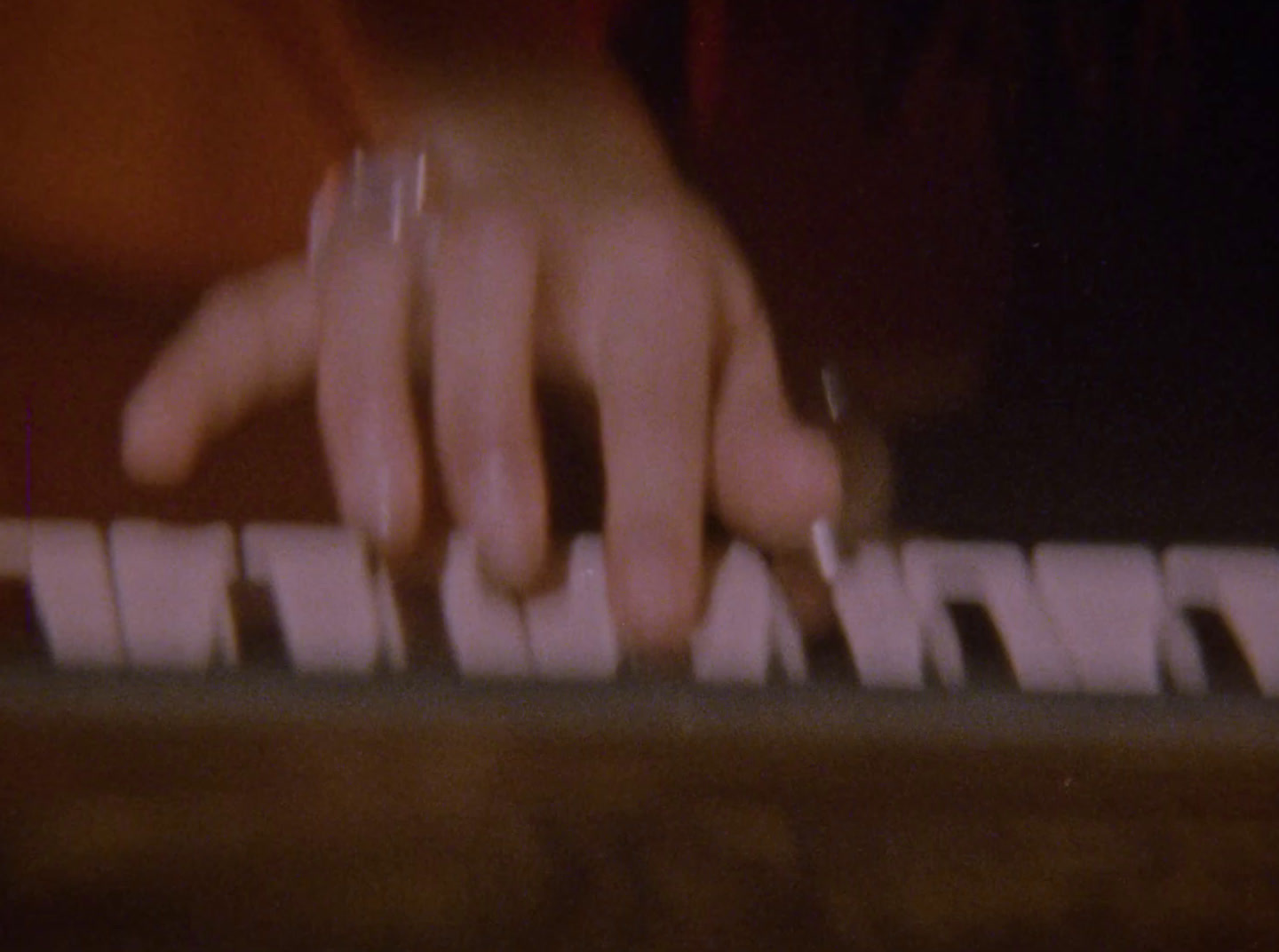 a close up of a person's hands on a keyboard