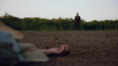 a person standing in the middle of a field