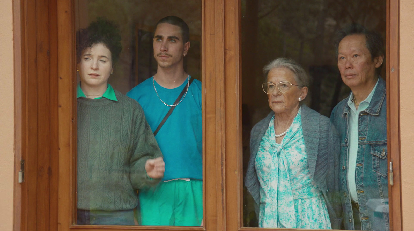 a group of people looking out of a window