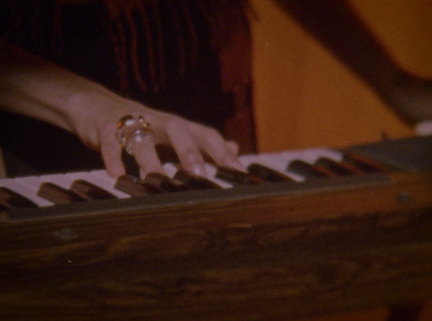 a close up of a person playing a piano