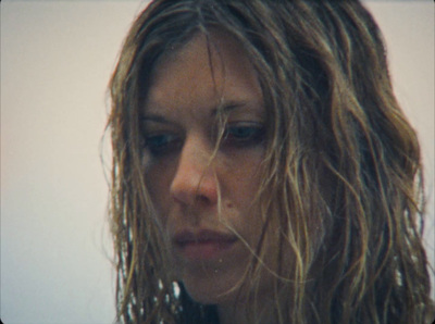 a close up of a person with wet hair