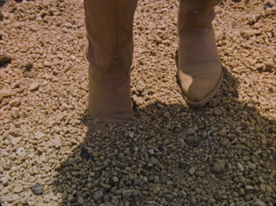 a person standing on a pile of rocks