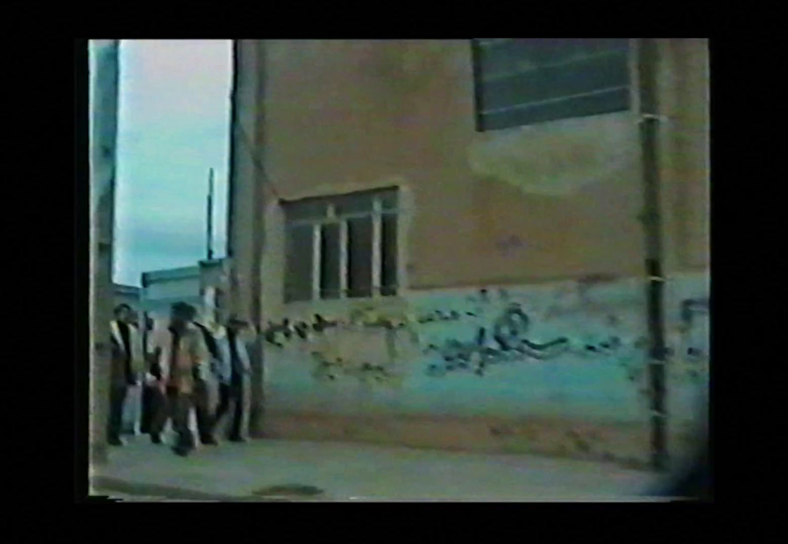 a group of people standing in front of a building