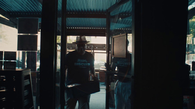 a man standing in the doorway of a building