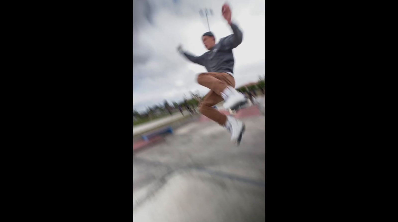 a man riding a skateboard up the side of a ramp