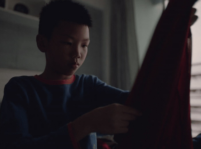 a man holding a red cloth in his hands