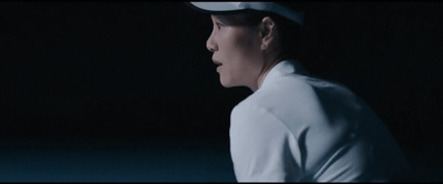 a man in a white baseball uniform and a white hat