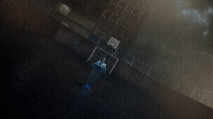 a fire hydrant in the middle of a street in the rain