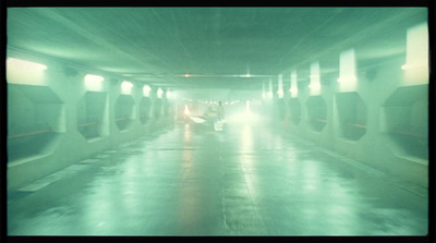 a car driving through a tunnel on a rainy day