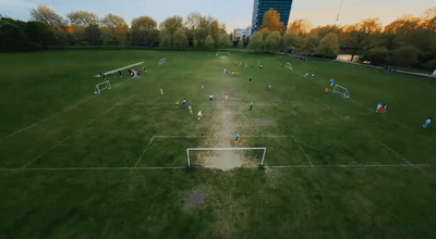 a group of people playing a game of soccer