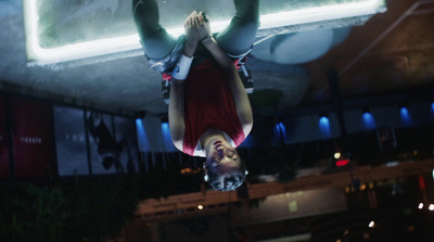 a person upside down in the air on a skateboard