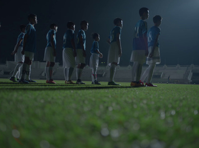 a group of young men standing on top of a soccer field