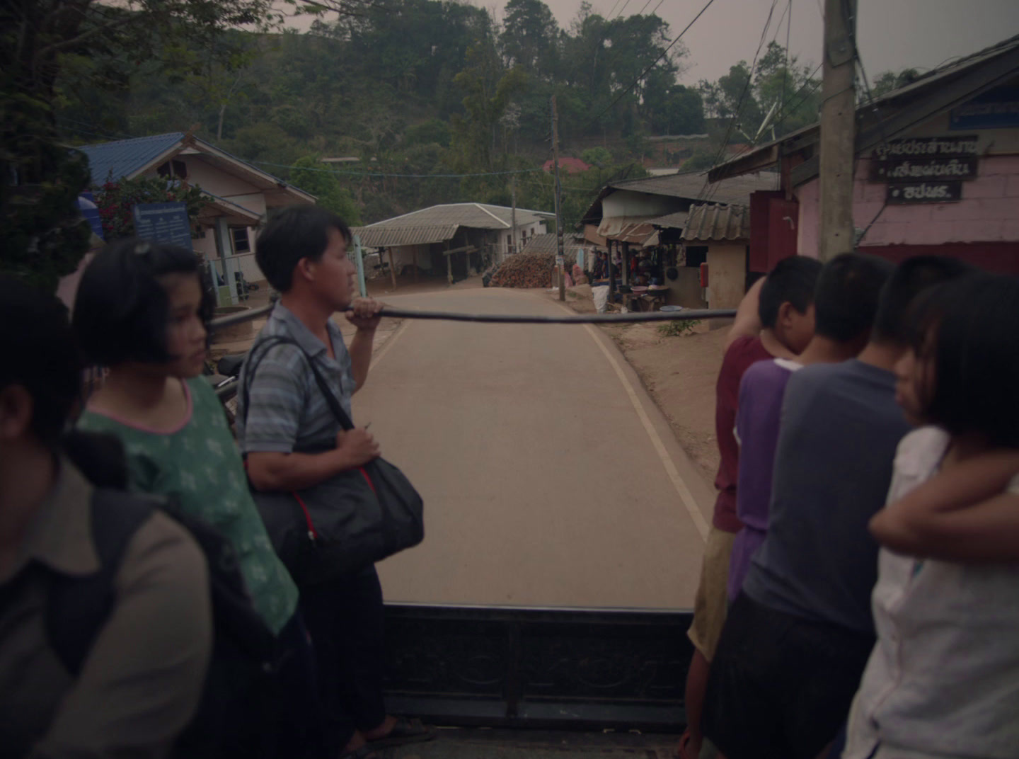 a group of people standing on the back of a truck