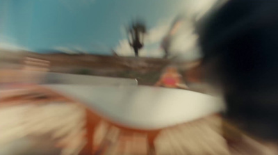 a blurry photo of a person riding a skateboard