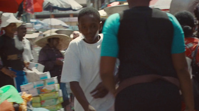 a group of people standing around a market