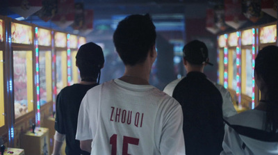 a group of people standing in front of a row of vending machines