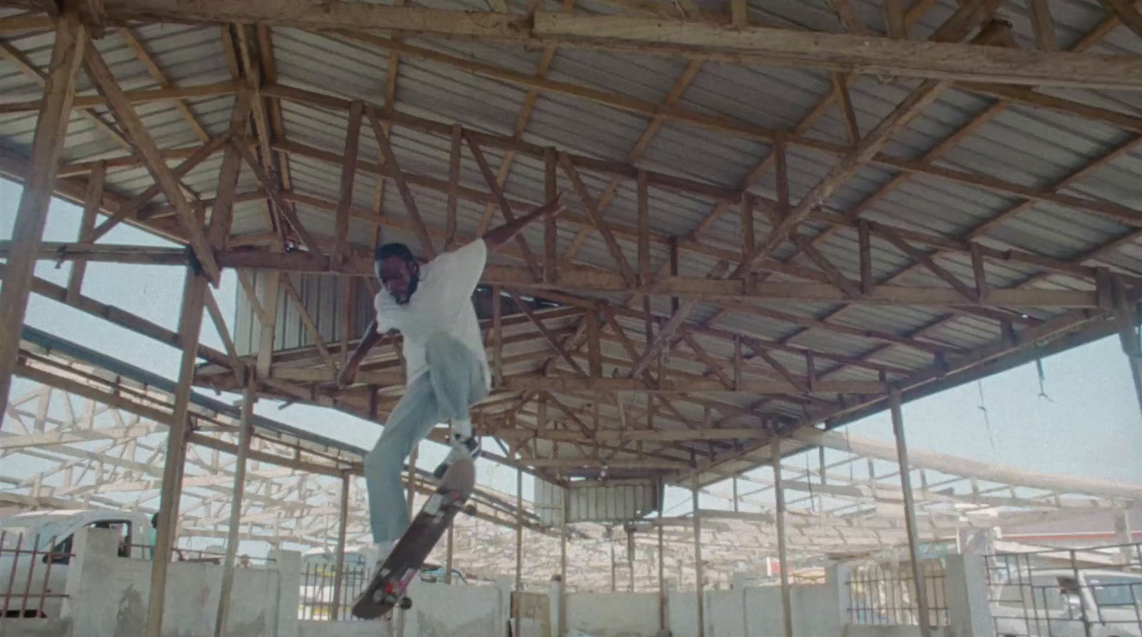 a man riding a snowboard on top of a wooden structure