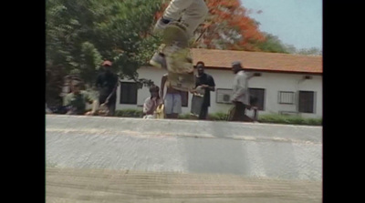 a man flying through the air while riding a skateboard