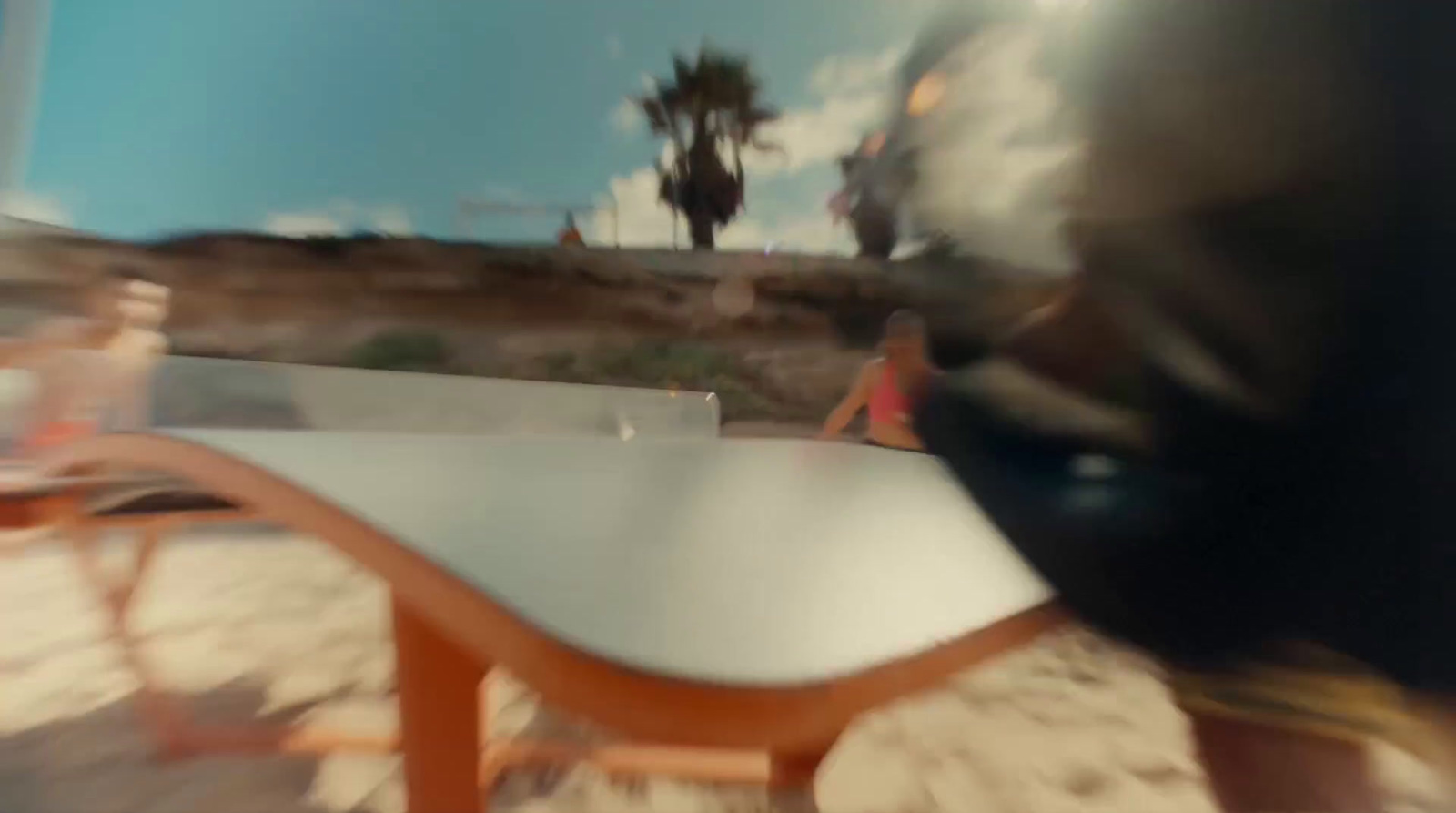 a blurry photo of a person sitting at a table