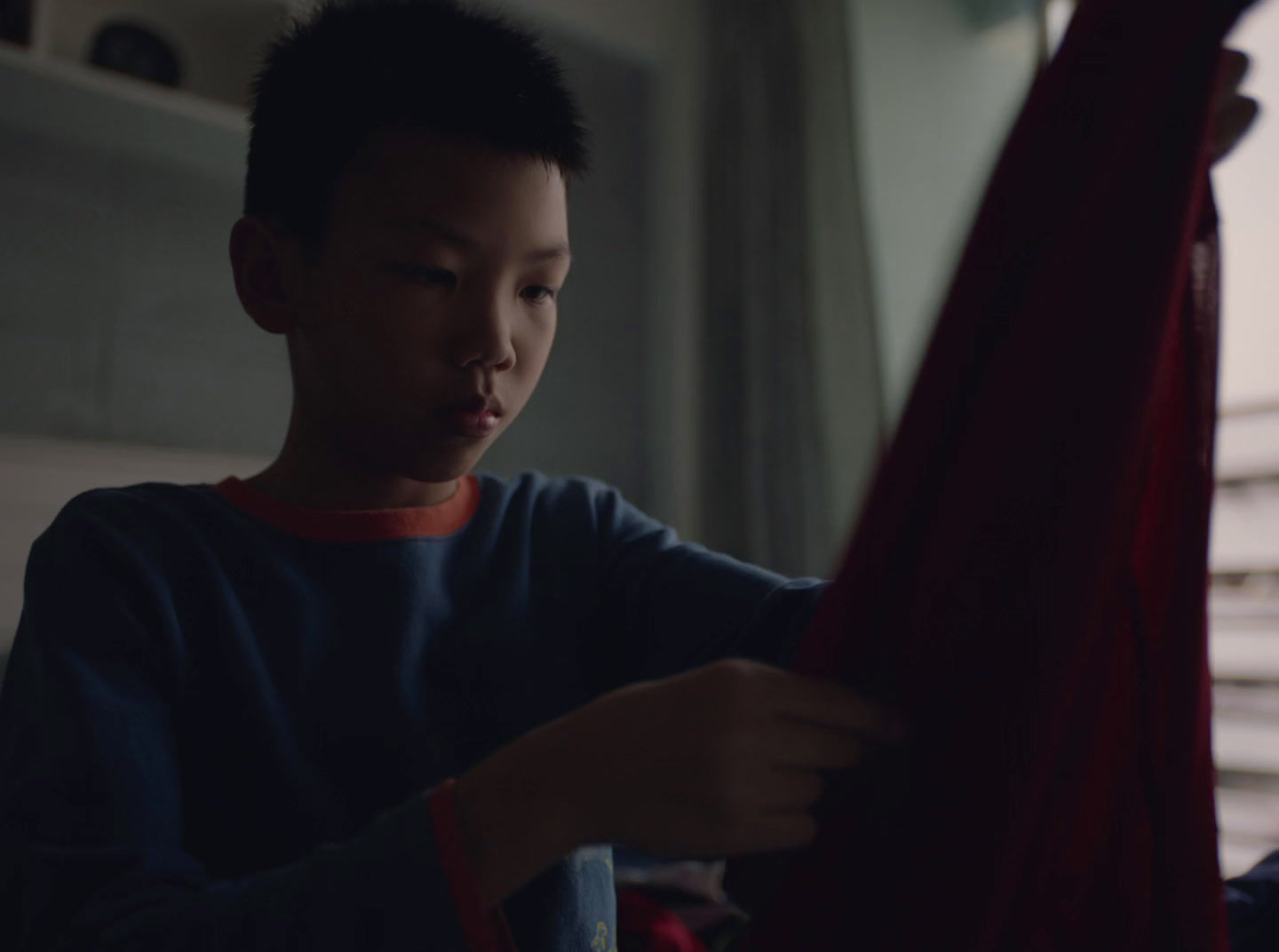 a man holding a red cloth in his hands