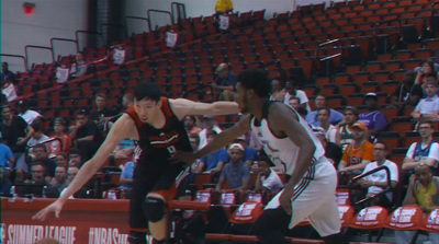 a group of men playing a game of basketball