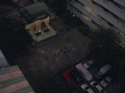 an aerial view of a parking lot at night