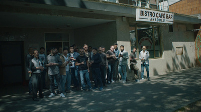 a group of people standing in front of a building