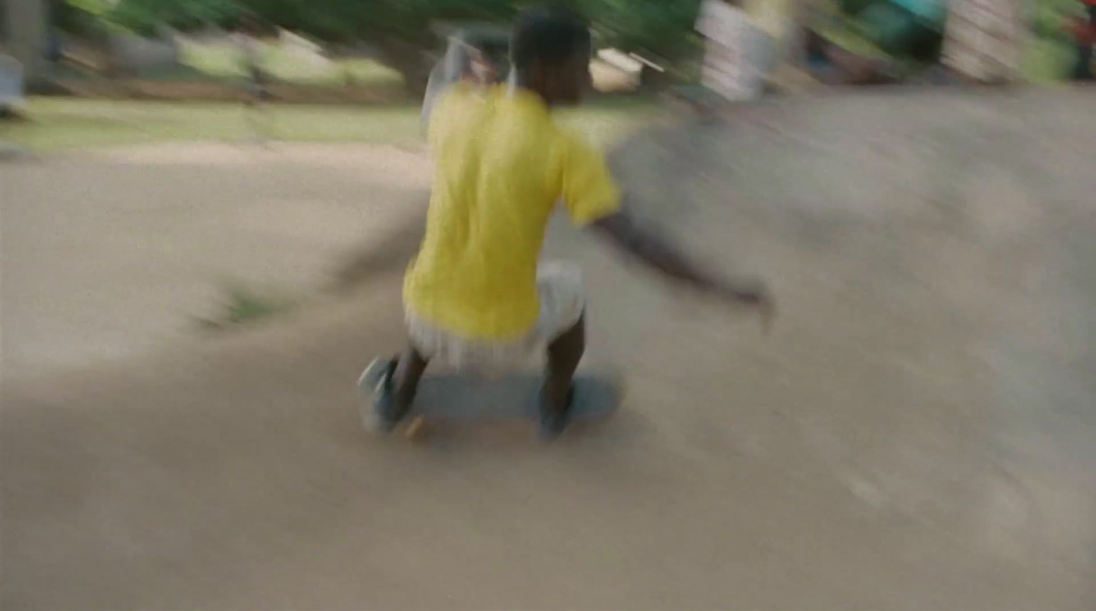 a blurry photo of a person riding a skateboard