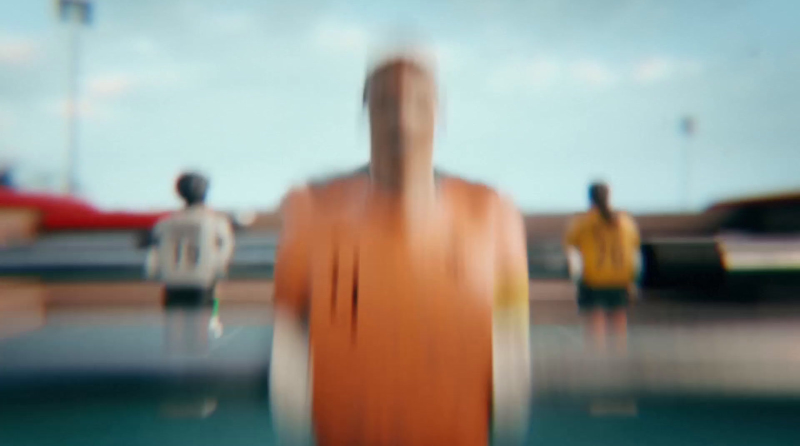 a blurry photo of a man standing in front of a car