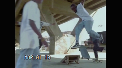 a man riding a skateboard up the side of a ramp