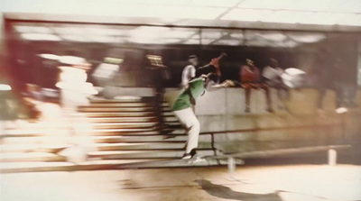 a man riding a skateboard down a set of stairs