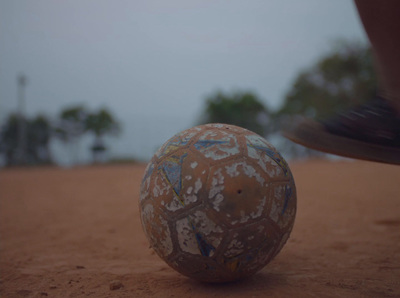 a worn out ball sitting on the ground